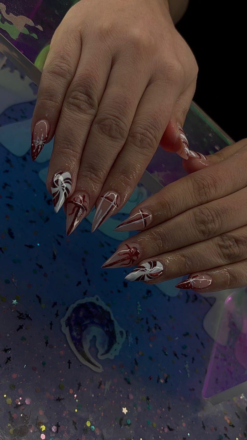 Lia nail art with brown sculpted tips, white accent art, and sharp graphic lines.