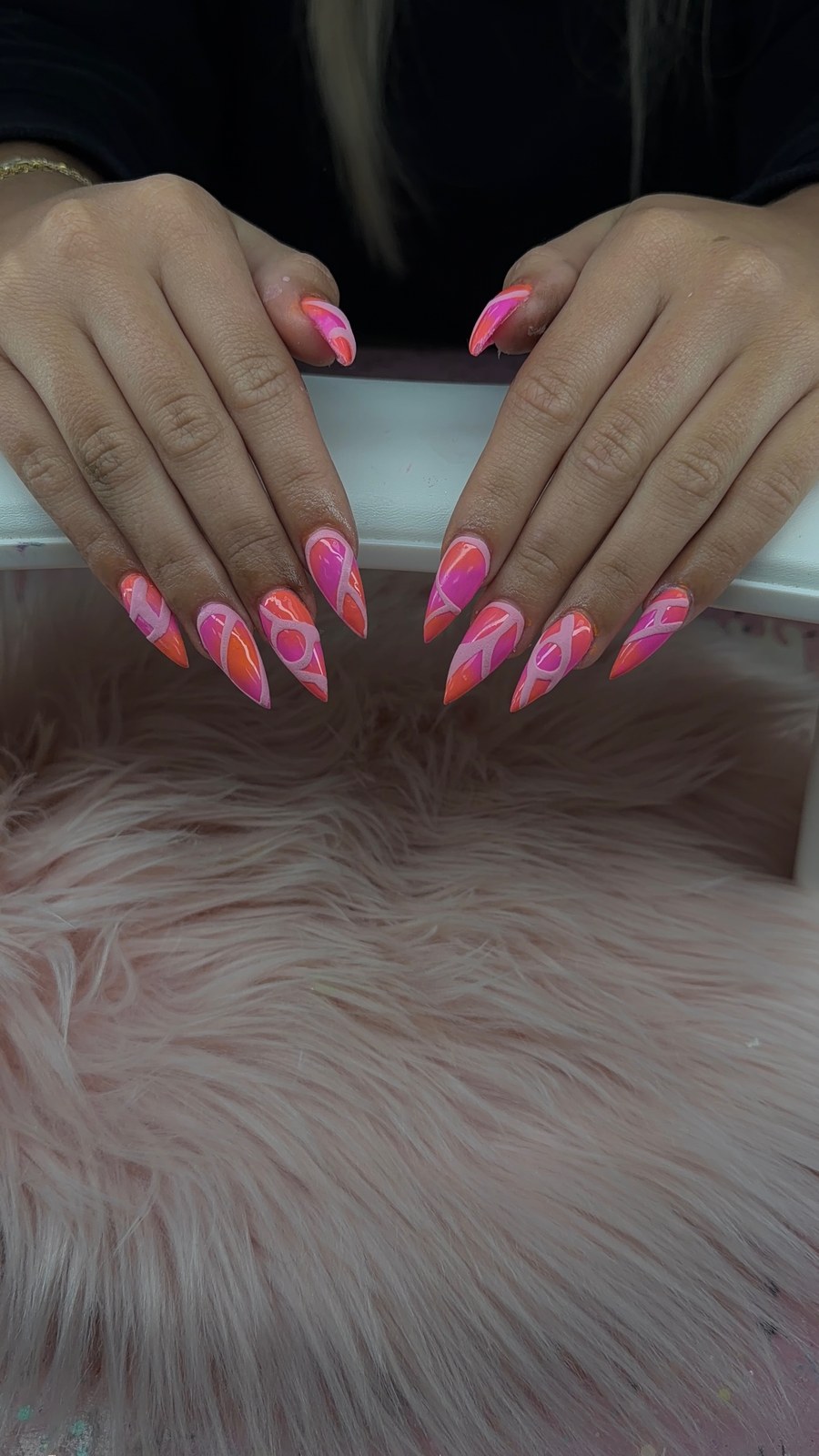 Serenity nail art with bright pink and orange swirl tips.